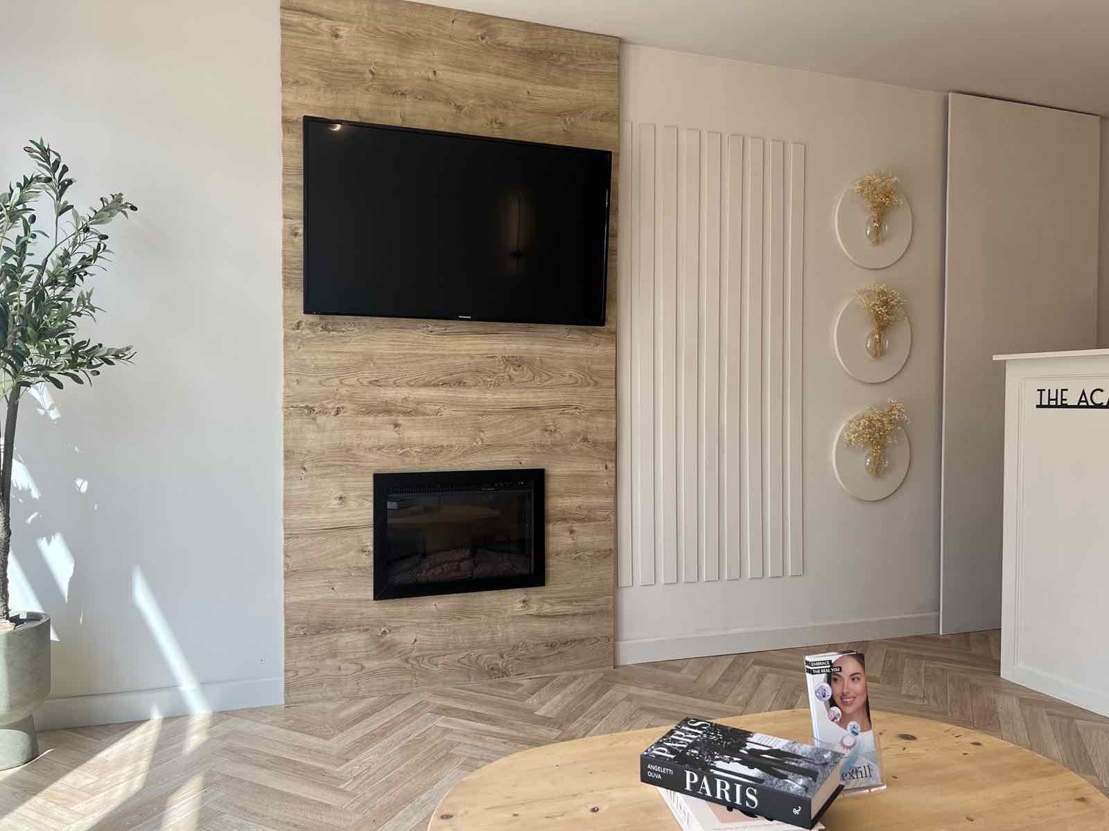 Tidied living room with fireplace and wall-mounted TV, Boston