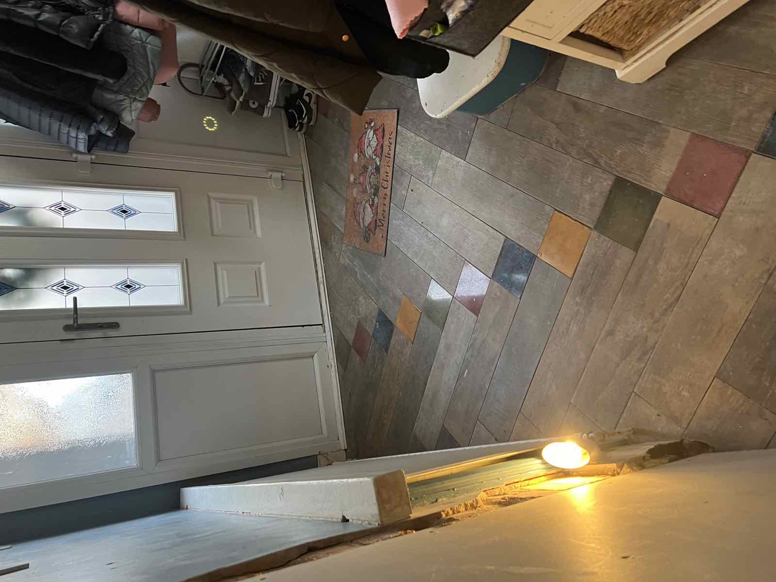 Clean patterned tile hallway floor by the front door, Boston